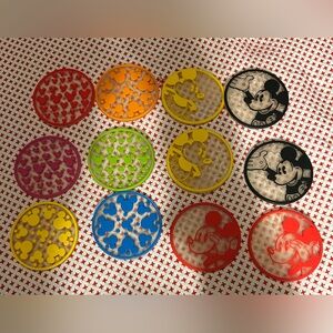 This is a set of 12 Disney rubber silicone drink coasters.
